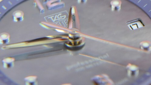 Mother-of-Pearl Tag Heuer dial Close-up of a Tag Heuer mother-of-pearl dial and hands