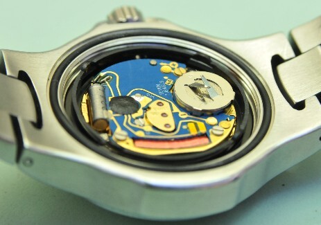 Tag Heuer Watch final casing up Tag Heuer watchcase with the back off showing the movement with that newly installed battery.